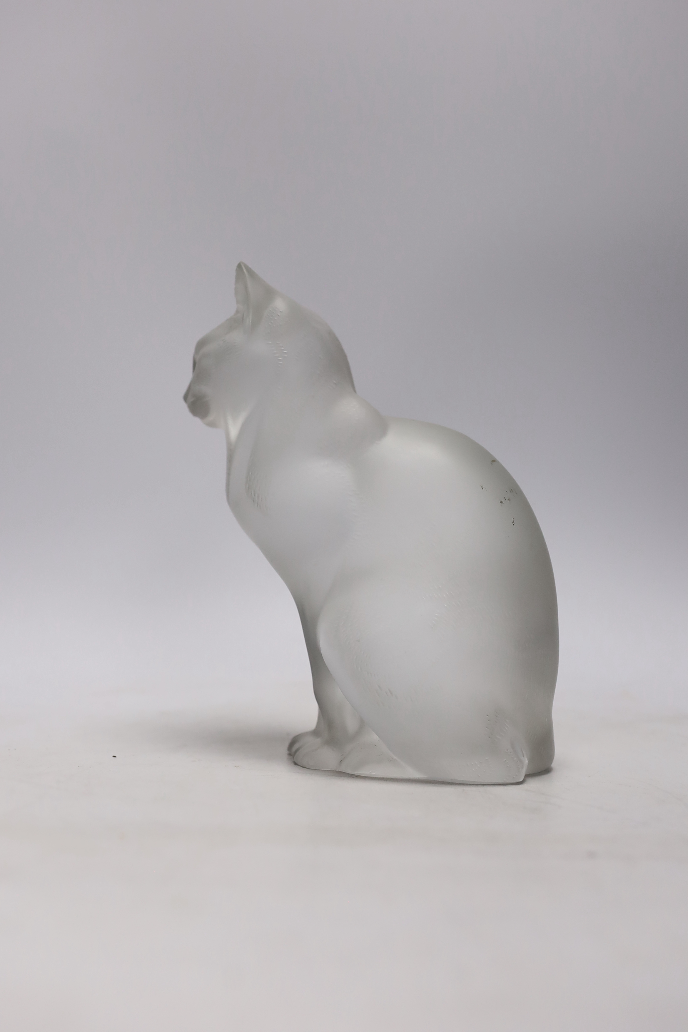 A Lalique glass seated cat, signed to the base, 20cm high